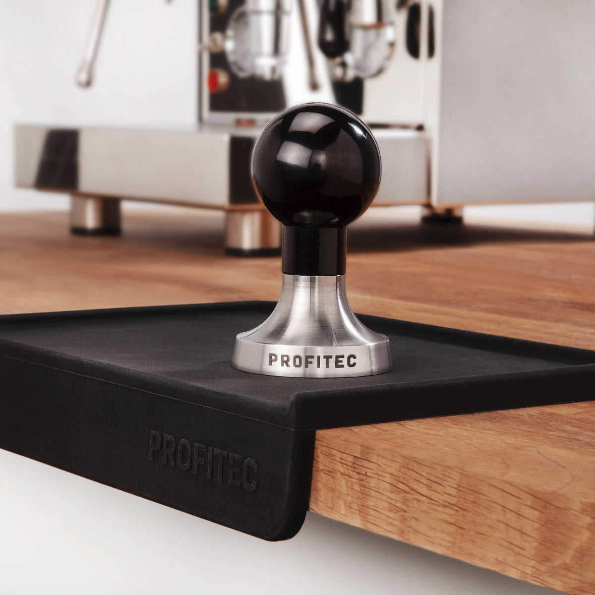 Profitec tamper with a profitec tamping mat full barista setup